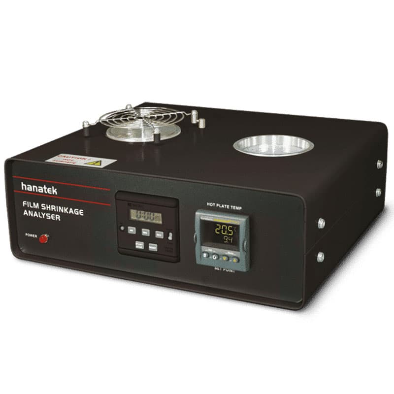Hanatek Film Shrinkage Analyser laboratory device – A black testing instrument with a temperature control panel, test chambers, and ventilation system, used for evaluating plastic film shrinkage properties.