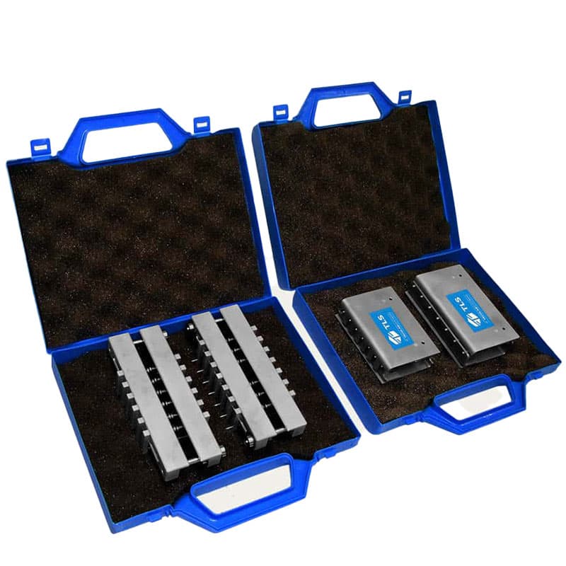 Crush test fixtures stored in protective cases for paper and cardboard testing.