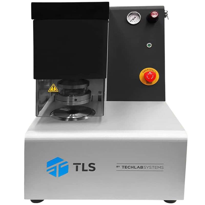 Front view of a Mullen burst tester with pressure gauge, emergency stop button, and protected test chamber.