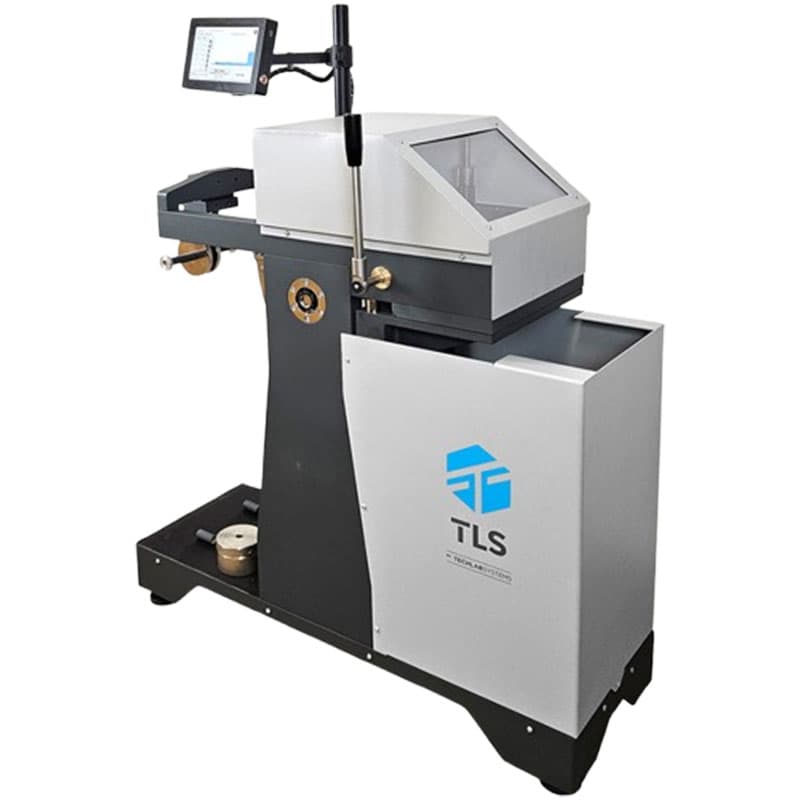 Side view of a puncture resistance tester with a touch-screen interface and robust metal housing.