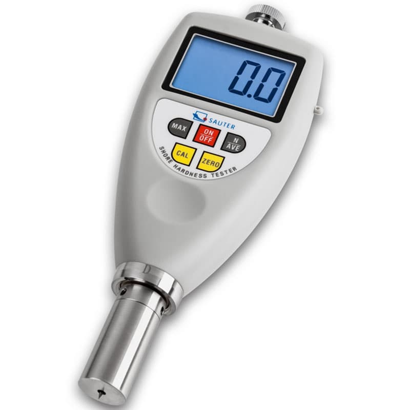 A Sauter Shore Hardness Tester with a digital display, function buttons, and a metal probe for measuring material hardness.