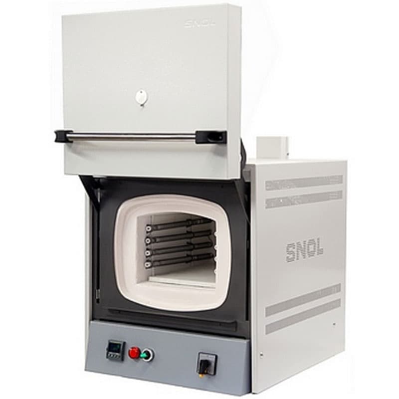 A laboratory muffle furnace with an open front-loading door, revealing the insulated chamber and heating elements inside. The furnace has a white and gray body with control buttons at the bottom.