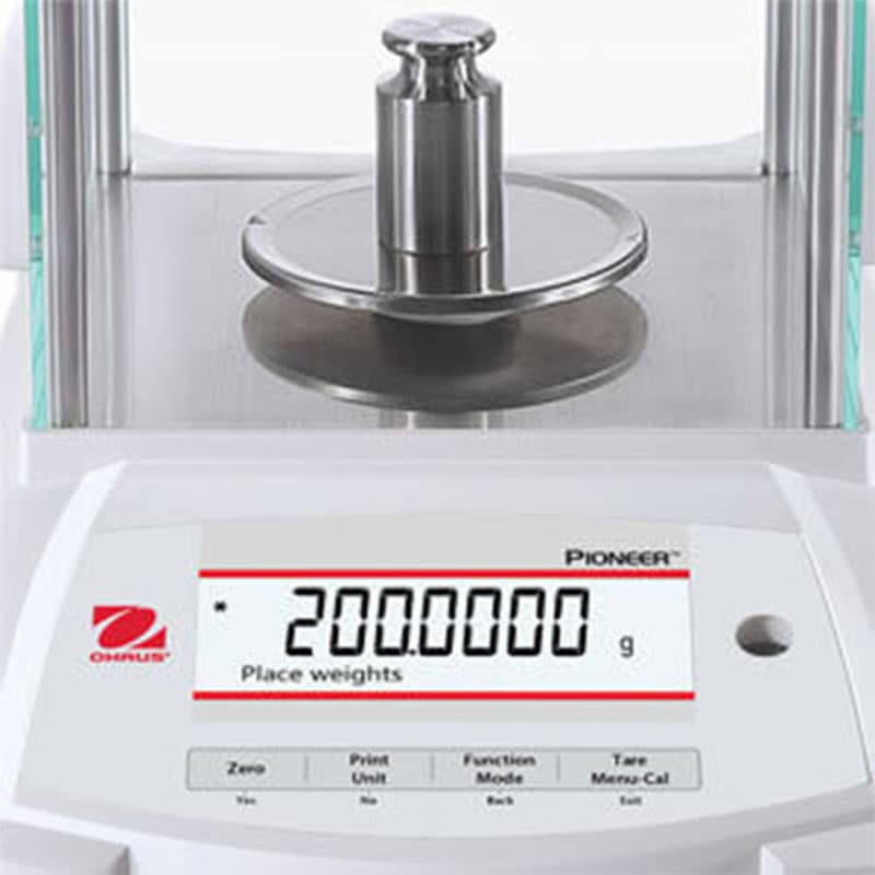 OHAUS Pioneer analytical balance displaying a 200-gram weight.