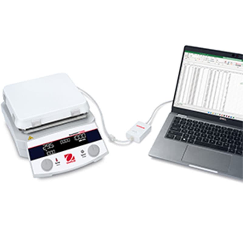 Close-up of a gloved hand adjusting the RPM settings on a digital magnetic stirrer.