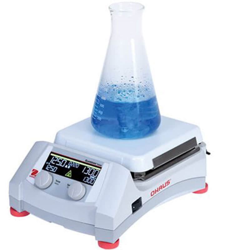 OHAUS Guardian 7000 hotplate stirrer with a conical flask containing blue liquid being heated and stirred on its white surface.