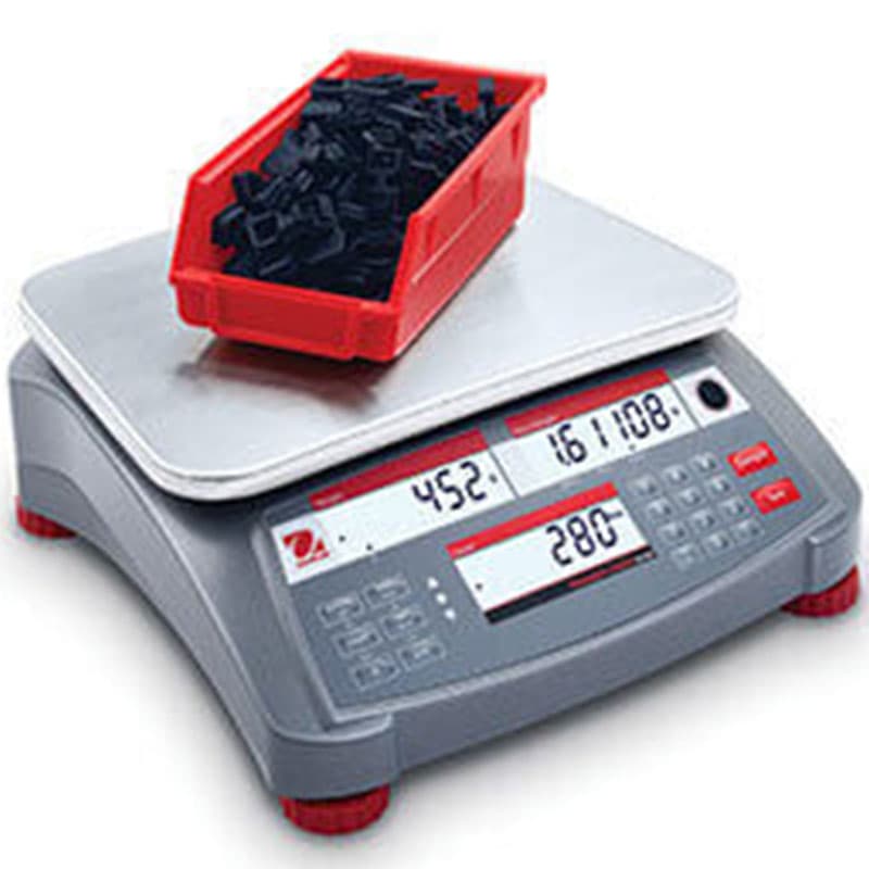 Black parts in red bin on OHAUS Ranger Count 4000 showing detailed weight and count.