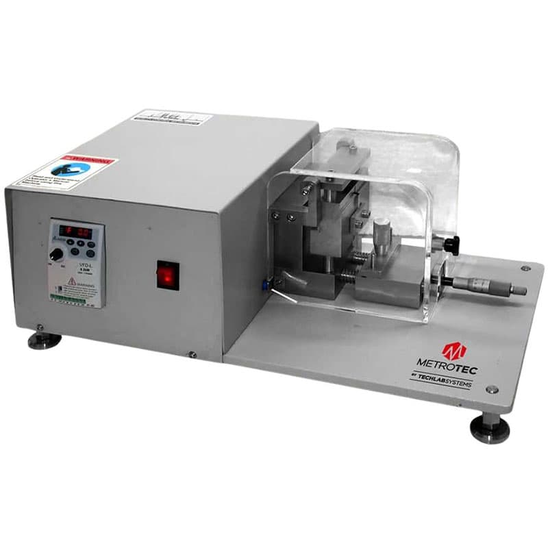 Charpy-Izod Notching Machine MNC-10 with control panel and protective enclosure.
