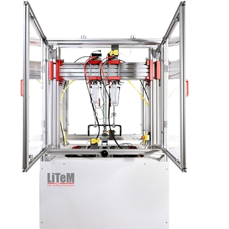 Front view of LiTeM BYC 200 modular fatigue testing machine with enclosed aluminium frame, dual actuators, and transparent safety panels for component fatigue testing.