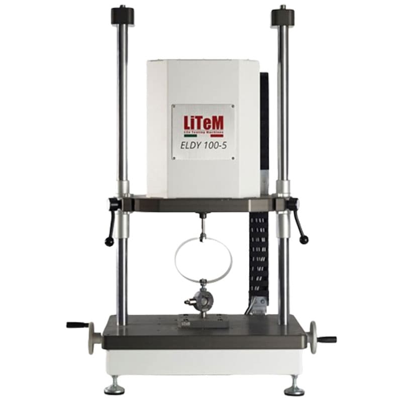 ELDY 100 fatigue testing machine with dual vertical columns, adjustable actuator unit, circular loading fixture, and stable base platform for cyclic material fatigue testing.