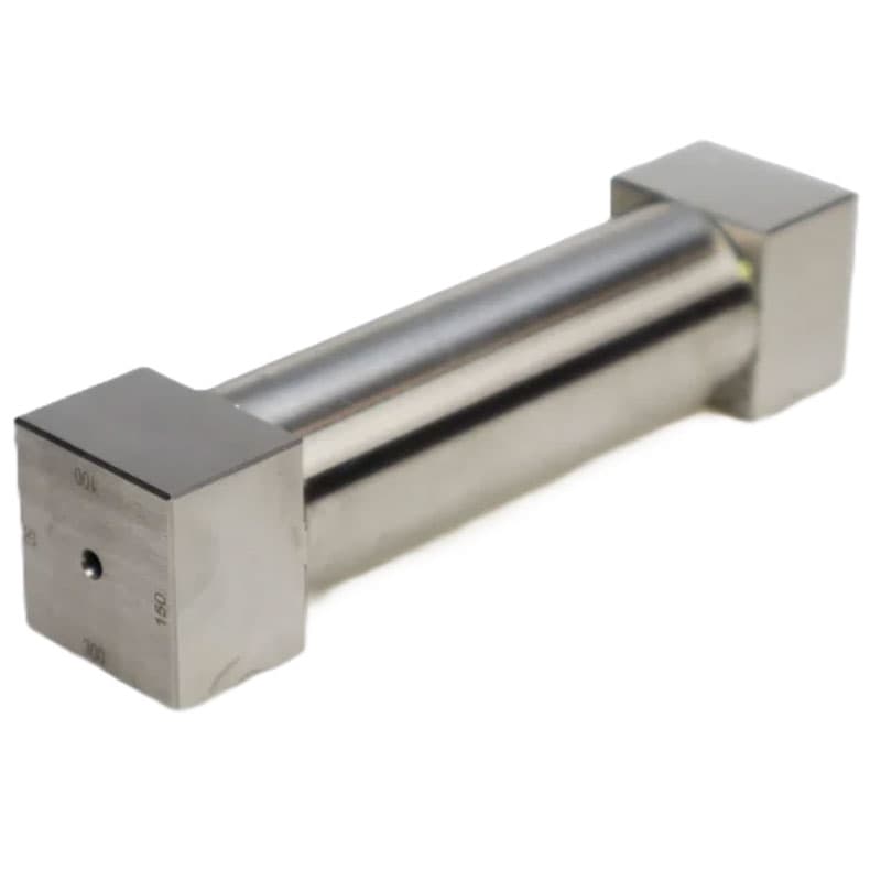 Perspective shot of a cylindrical instrument lying horizontally, showcasing its smooth surface and engraved square ends.