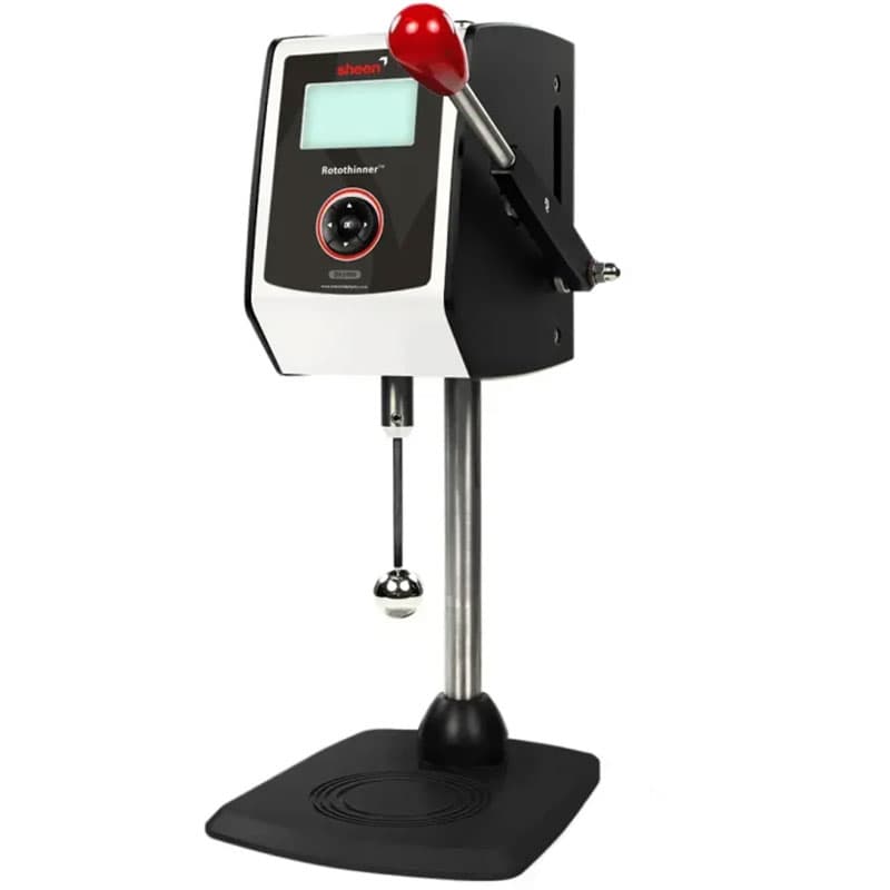 TQC Sheen Rotothinner with a digital display, red lever handle, and spindle for viscosity and thinning measurements of liquids.