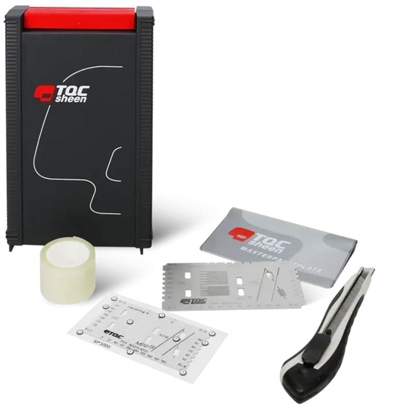 TQC Sheen paint testing kit with a black storage case, adhesive tape, utility knife, and metal templates for paint quality measurement.