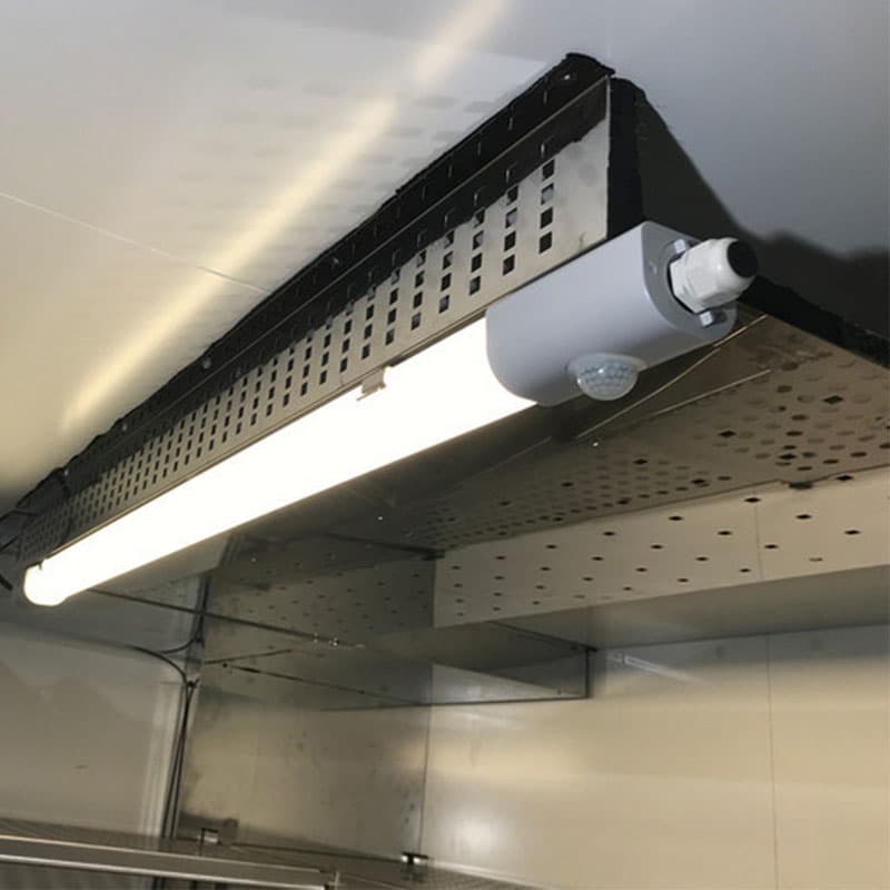 Ceiling light inside a Binder stability chamber with a bright LED and metallic ventilation panels.