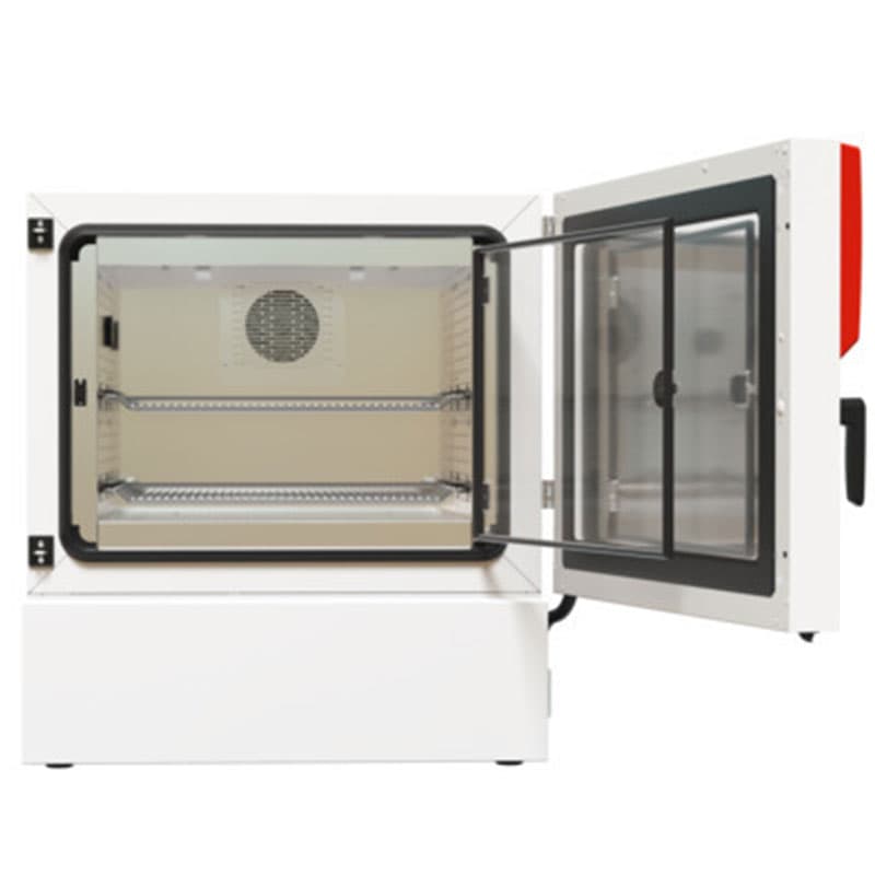 Open BINDER climate chamber showing interior – A laboratory climate chamber with its door open, featuring a ventilated stainless steel interior, two adjustable metal shelves, and an inner glass door for insulation.
