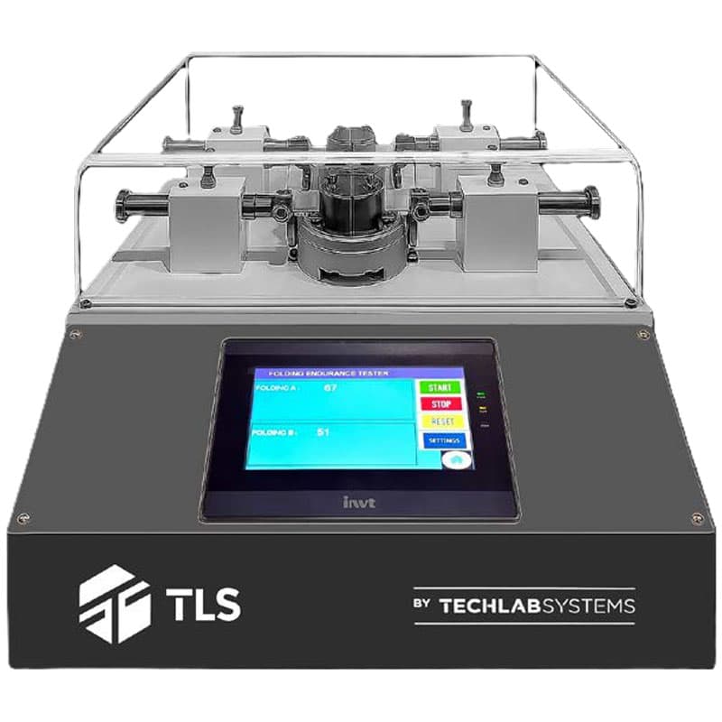 Folding Endurance Tester by Techlab Systems with touchscreen control and dual-sample testing mechanism under a transparent safety cover.