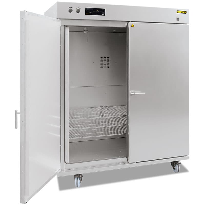 Large laboratory oven with double doors open and multiple shelves inside.