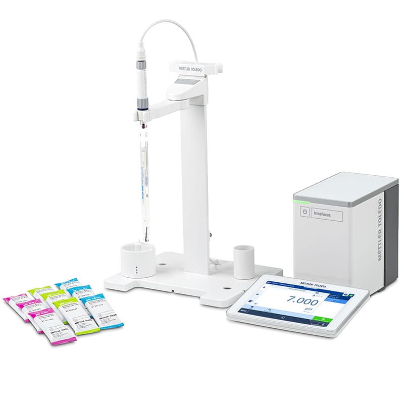 Mettler Toledo NineFocus NF2000 Pure H2O pH meter kit with pH electrode, electrode stand, touchscreen display, control unit, and pH calibration buffer sachets for laboratory pure water testing.
