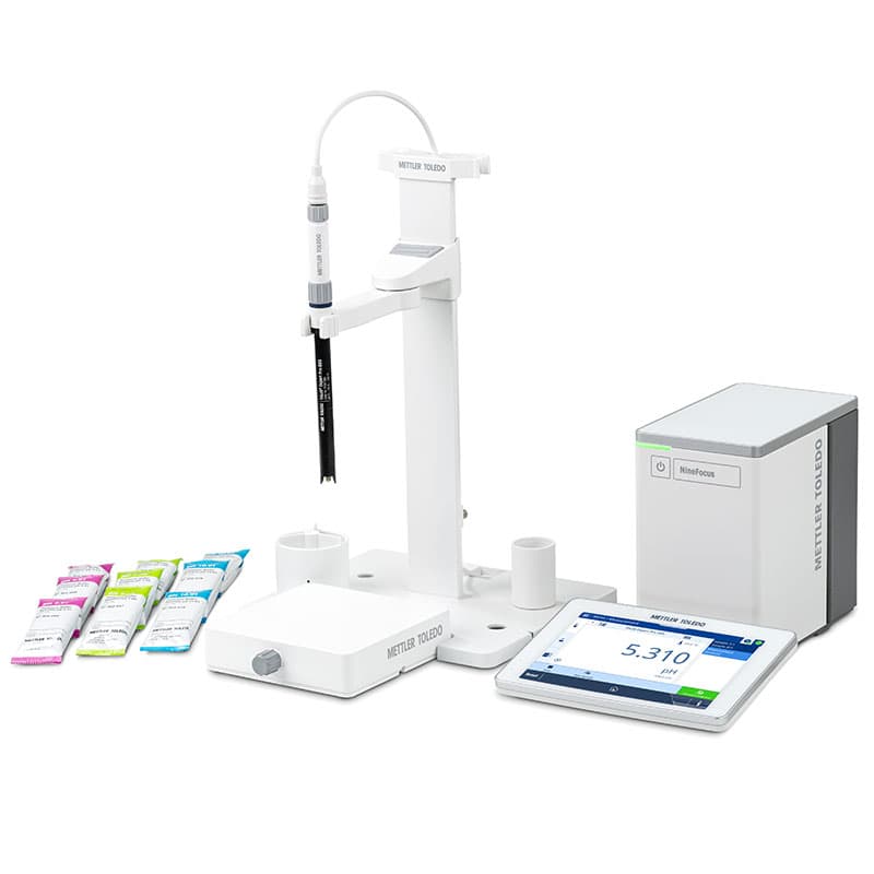 Mettler Toledo NineFocus NF2000 pH meter stirrer kit with magnetic stirrer base, pH electrode, electrode stand, touchscreen display, control unit, and pH buffer sachets for laboratory pH testing.