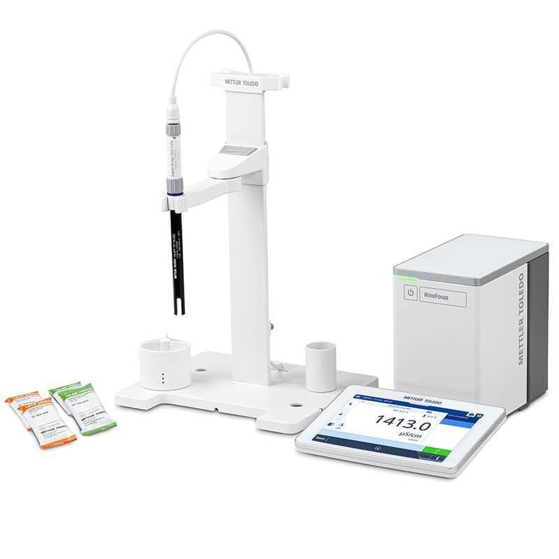 Mettler Toledo NineFocus NF3000 conductivity meter kit with probe, electrode stand, touchscreen display, control unit, and conductivity calibration sachets for laboratory water testing.