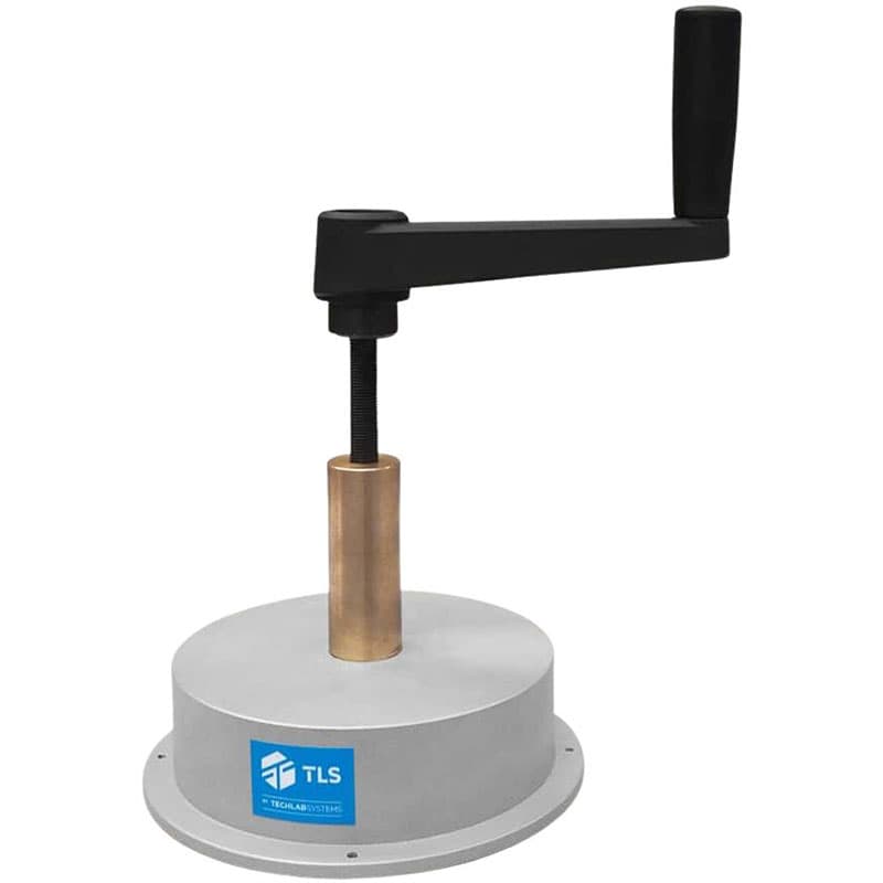 Manual circular cutting press with crank handle mounted on a round base.