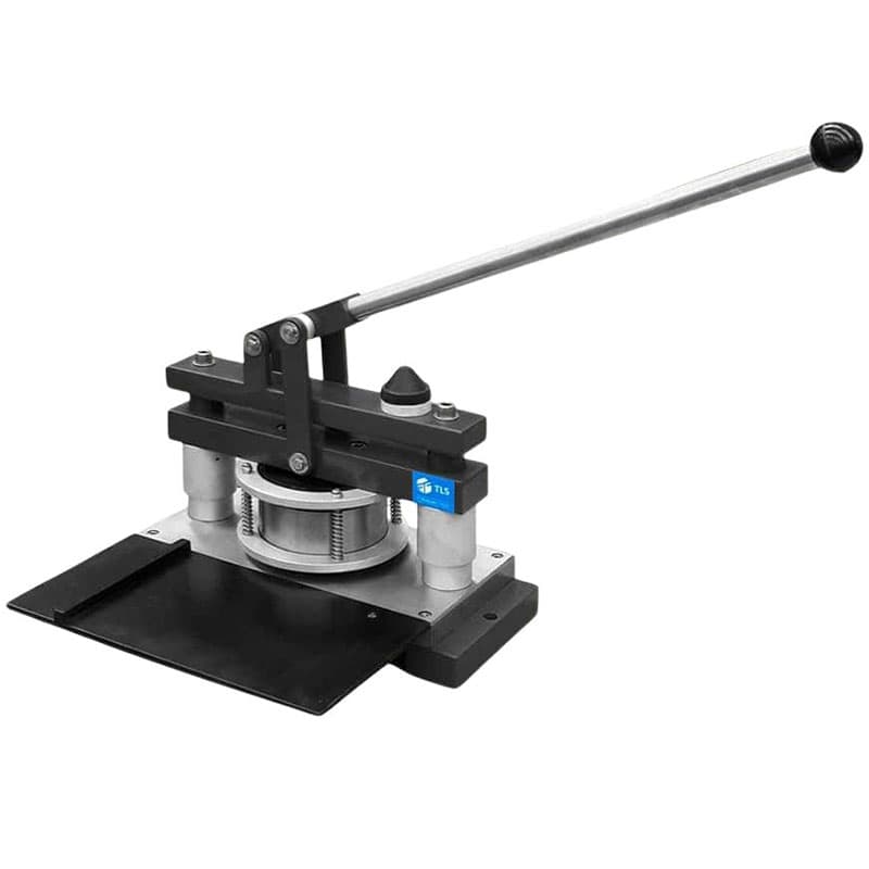 Manual punch die press with circular die configuration and lever mechanism.