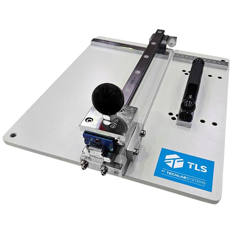 Manual ECT/PAT sample cutter with sliding blade mechanism and measurement guide on a flat base.