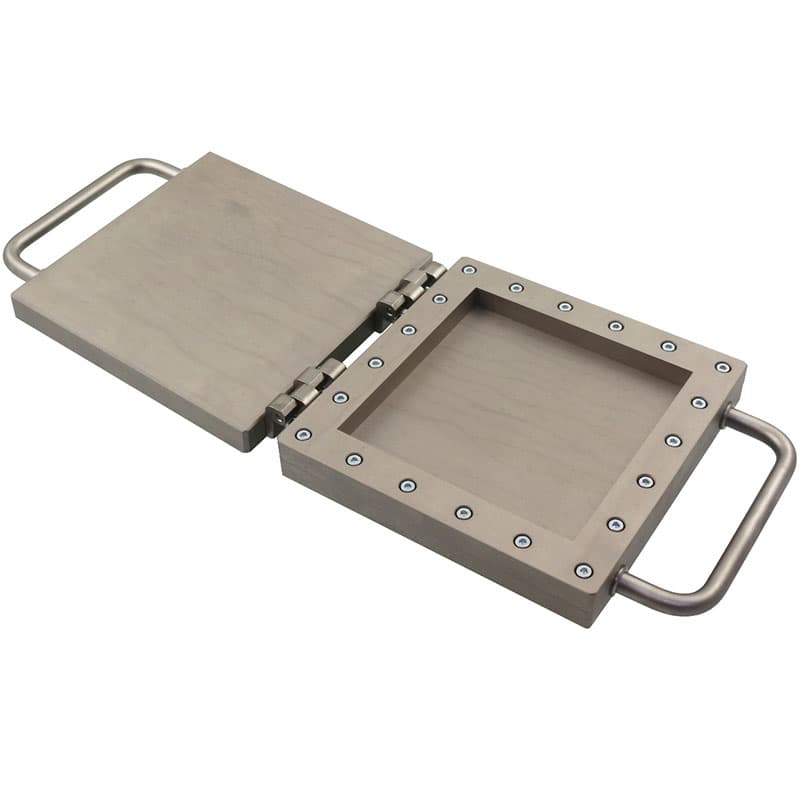 Open THS1390 mould with square cavity and hinged lid, viewed from above.