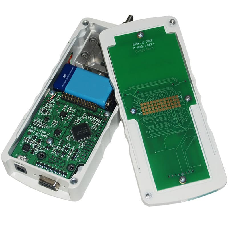 Open Series 4 digital force gauge showing internal circuit boards, battery, and reversible housing design.