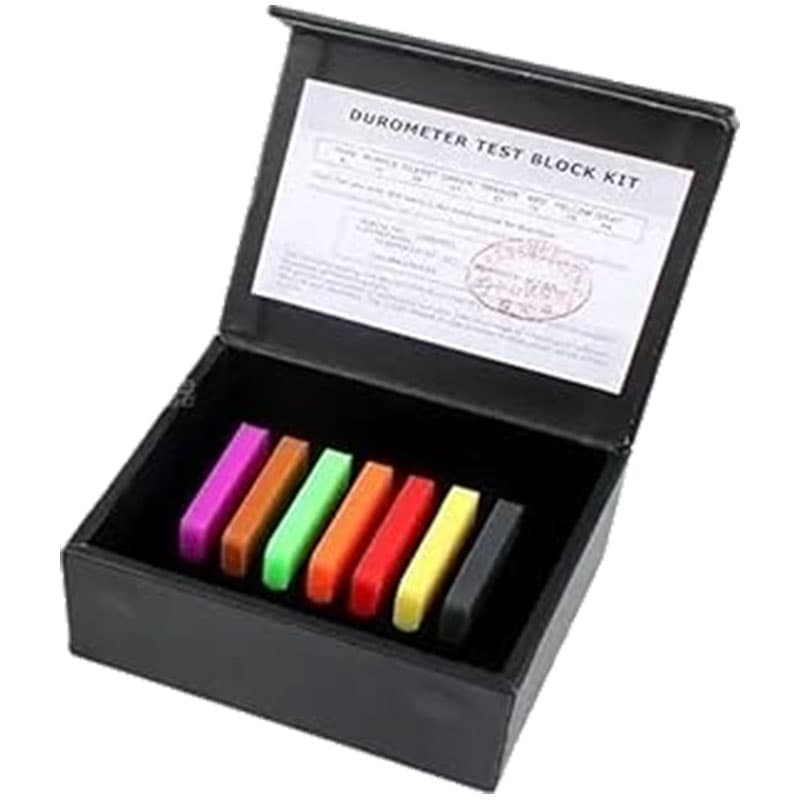 Shore A durometer reference block kit with seven colour-coded hardness test blocks supplied in a protective black storage case.