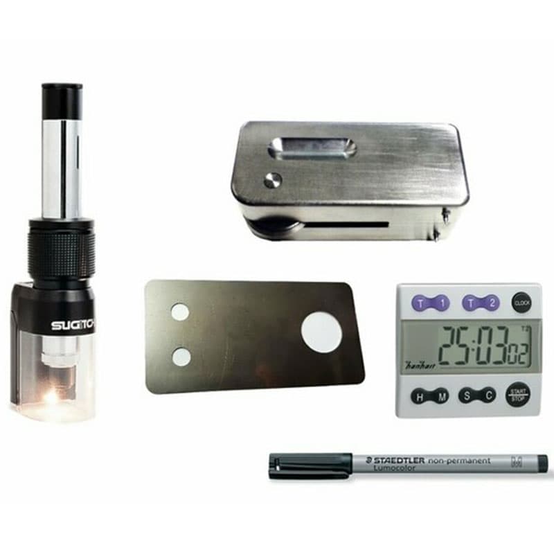Buchholz Hardness Tester kit with indentation instrument, illuminated magnifier, metal test plate, digital timer and marker pen.