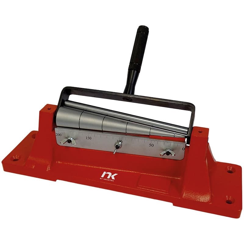 NEURTEK Conical Mandrel Bend Tester with tapered metal mandrel, graduated scale, manual bending lever and red base.