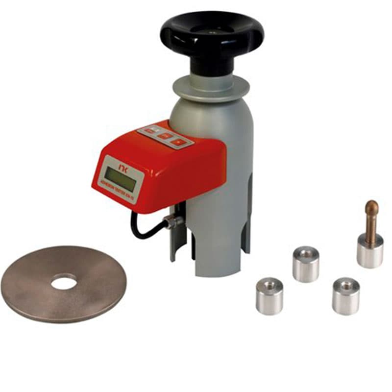 NEURTEK KN-10 Pull-Off Adhesion Tester with digital measuring unit, manual loading mechanism, circular test dolly and metal accessories.