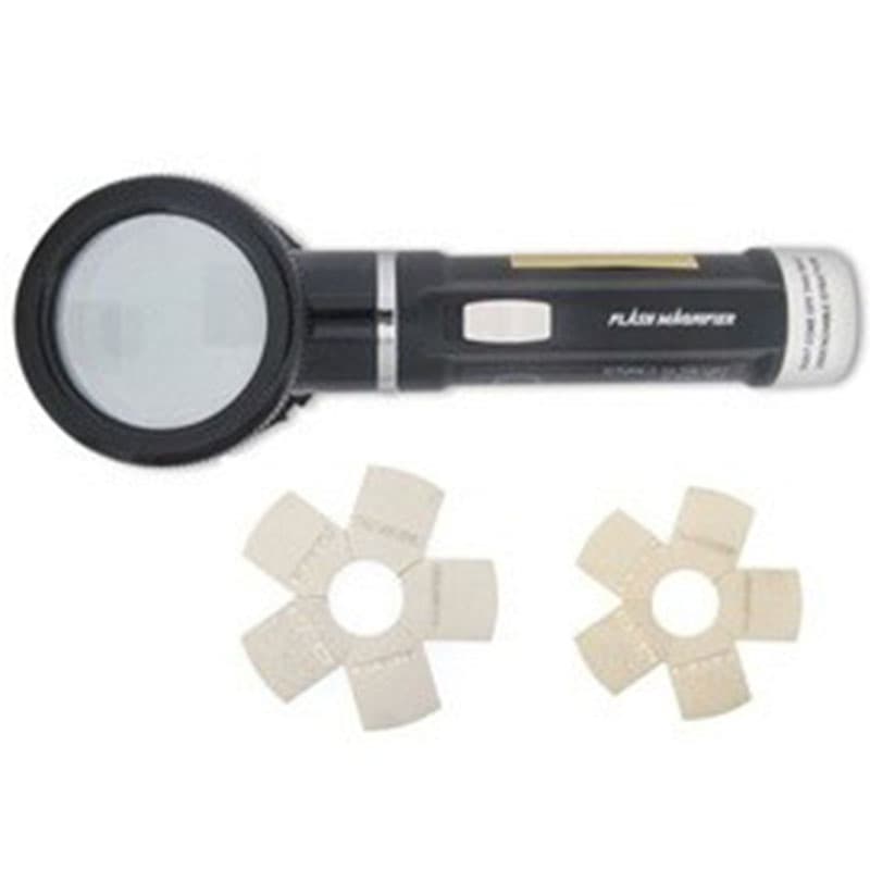 Keane-Tator Surface Profile Comparator with handheld illuminated magnifier and two star-shaped surface comparison discs.