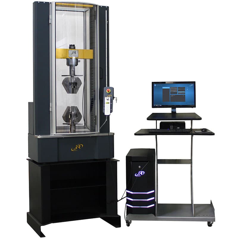 SYNTAX 100 High-Stiffness Universal Testing Machine – 100 kN with heavy-duty grips, closed transparent safety enclosure, digital controller, and computer workstation.