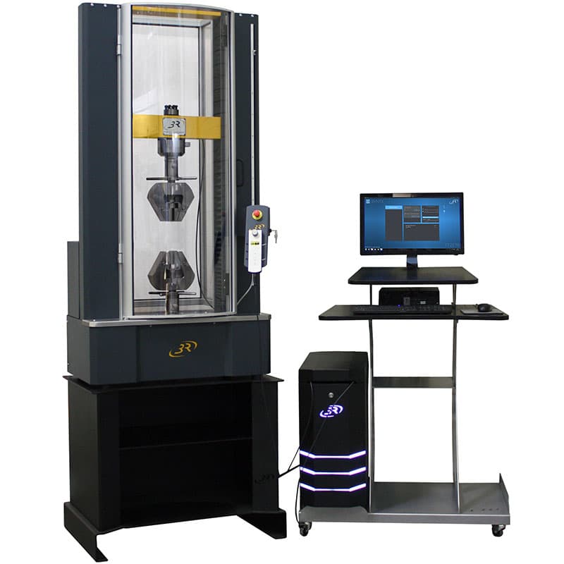 SYNTAX 25 Mid-Range Universal Testing Machine – 25 kN with specimen grips, closed transparent safety enclosure, digital controller, and computer workstation.