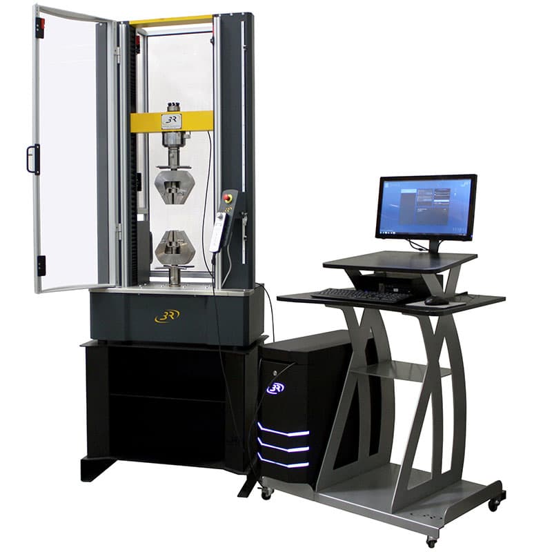 SYNTAX 25 Mid-Range Universal Testing Machine – 25 kN with tensile grips, open safety enclosure, digital controller, and computer workstation.