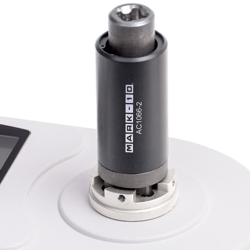 Close-up of a Mark-10 AC1066-2 adapter installed on a Series TT02 torque tool tester.