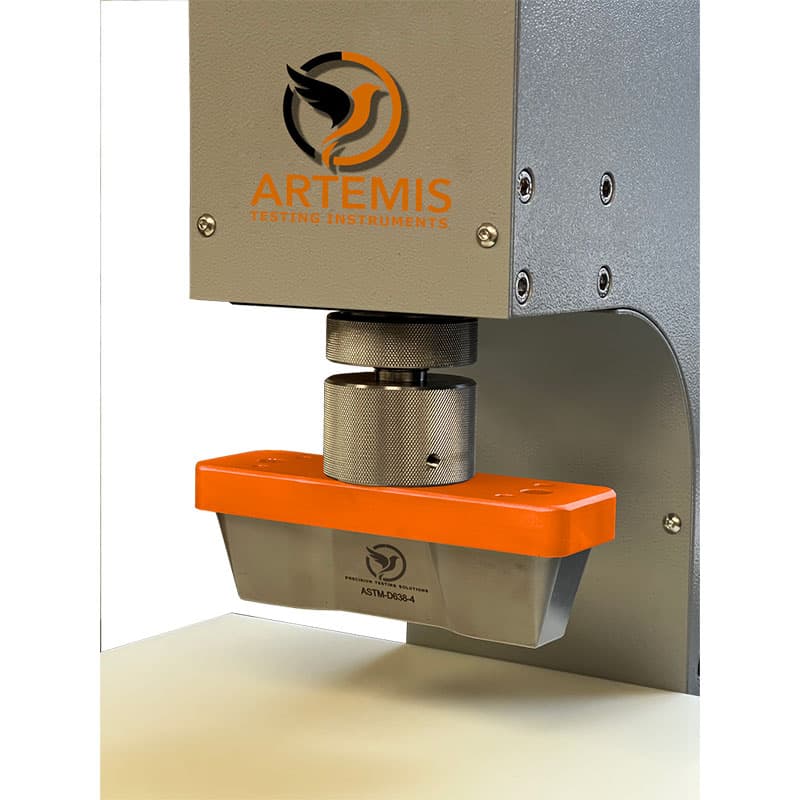 Artemis ART-TSCD test sample cutting die installed in a pneumatic press for preparing material test specimens.