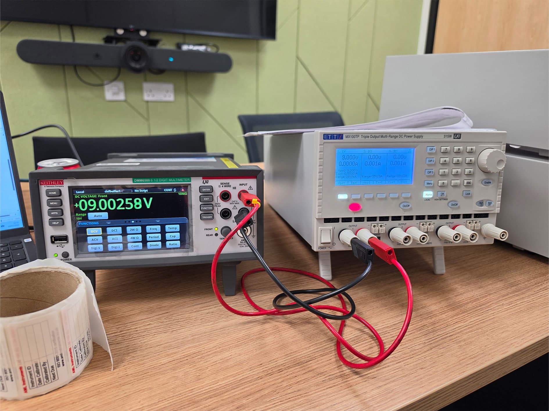 Keithley DMM6500 multimeter measuring approximately 9 V DC from a TTi MX100TP power supply during calibration.