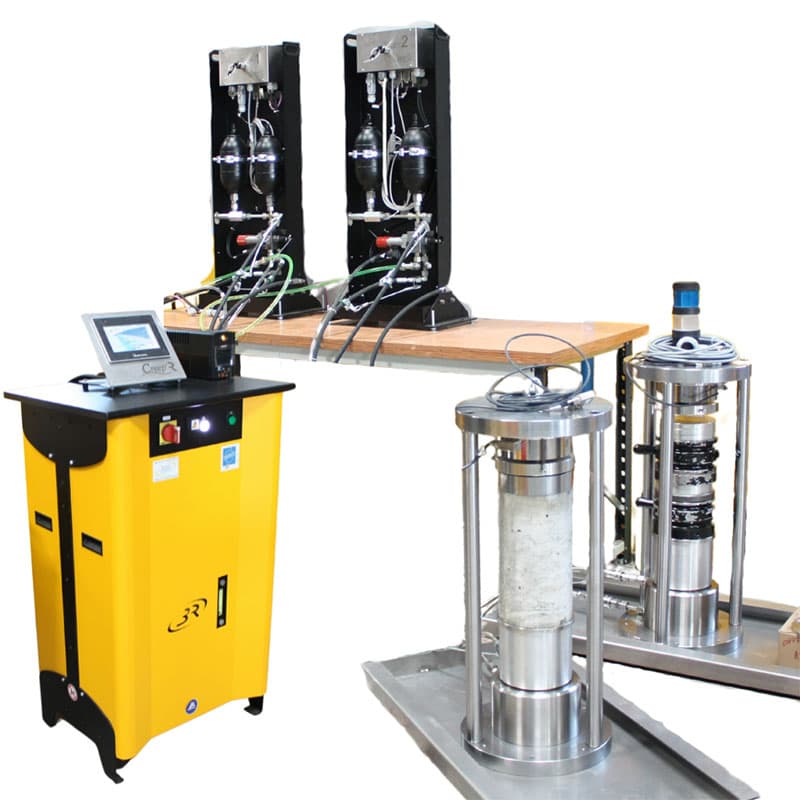 Complete CREEP'R control system connected to multiple creep testing frames containing cylindrical test specimens.