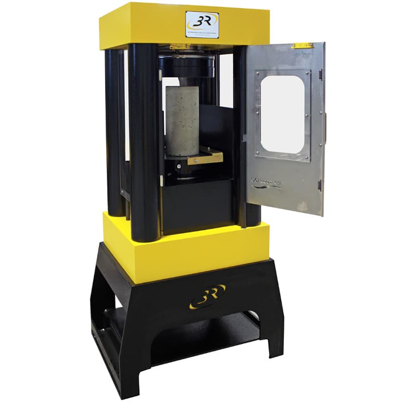Four-column 3000 kN compression testing machine with open safety door and vertical concrete cylinder positioned between the compression platens.