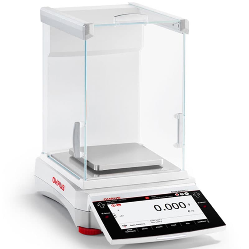 Angled side view of the OHAUS Explorer EXR Precision Balance with the draft shield in place, emphasising its sturdy and clear enclosure.