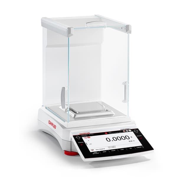 Angled view of OHAUS Explorer analytical balance with touchscreen display and draft shield.