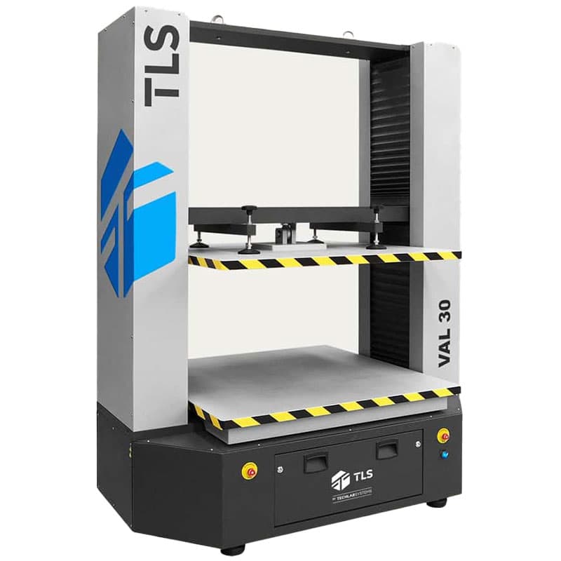 Perspective view of the VAL-30 Box Compression Tester showing top and bottom platforms with black and yellow stripes.
