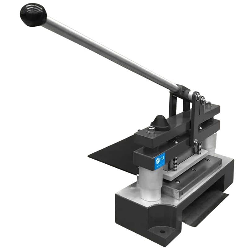 Side view of manual punch die press with extended lever and sample tray.