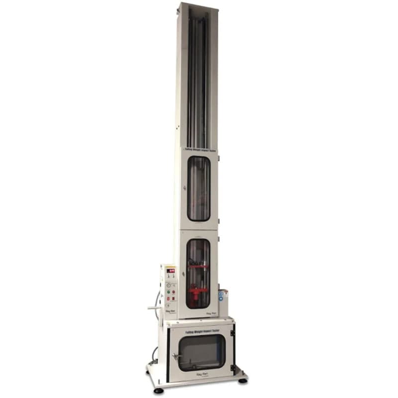 Ray-Ran falling weight impact tester with tall vertical drop column, enclosed testing chamber, and front-mounted control panel.