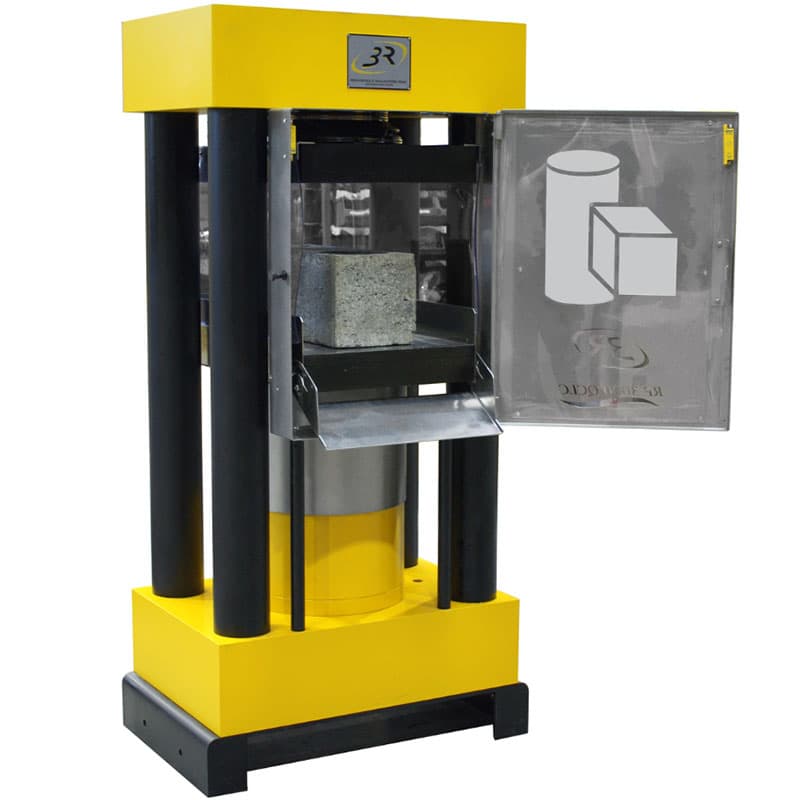 2000 kN four-column long-stroke compression testing machine with open safety door and concrete cube inside the testing chamber.