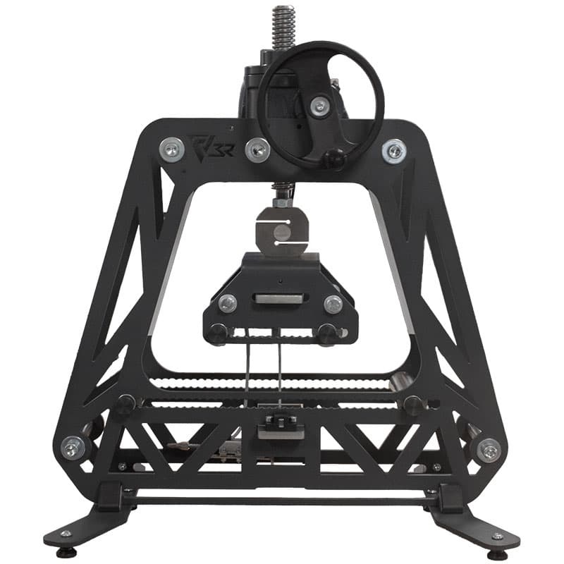 Front view of a Manual Educational Test Bench with handwheel-operated loading system, central test fixture, open frame, and visible mechanical components.