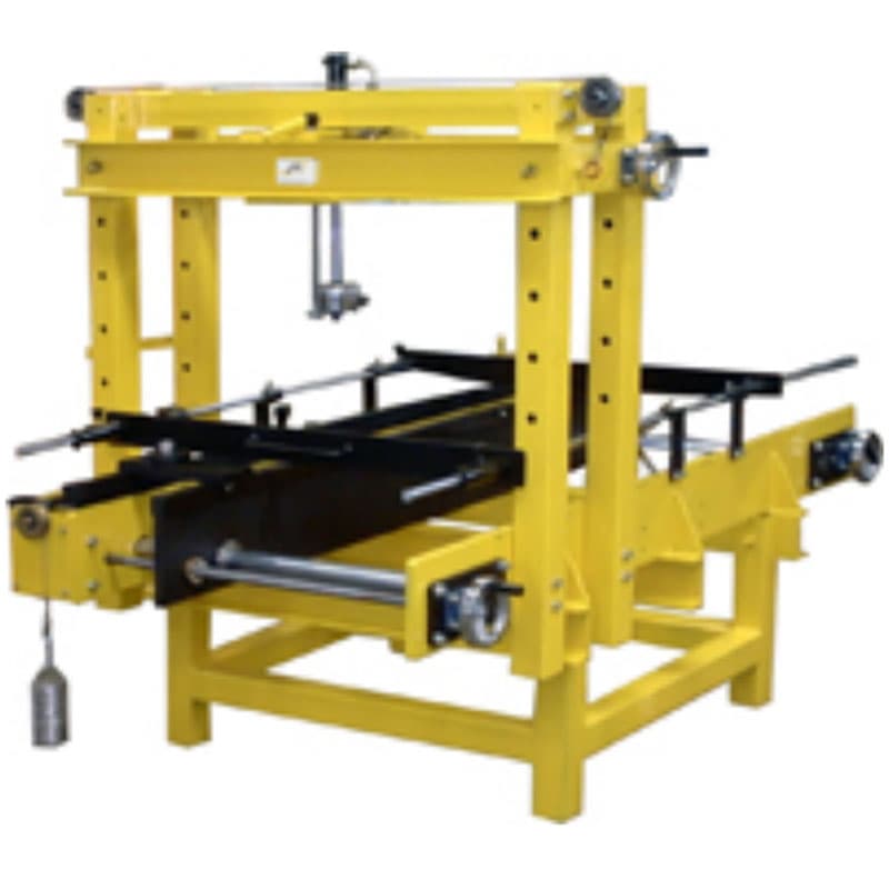 5 kN flexural testing machine for polystyrene infill blocks with yellow steel frame, adjustable loading assembly, and horizontal specimen supports.